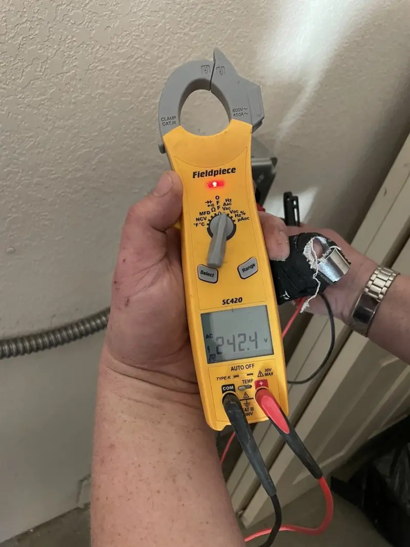 Voltage testing with clamp meter during Ceiling Fan Installation in Gluckstadt